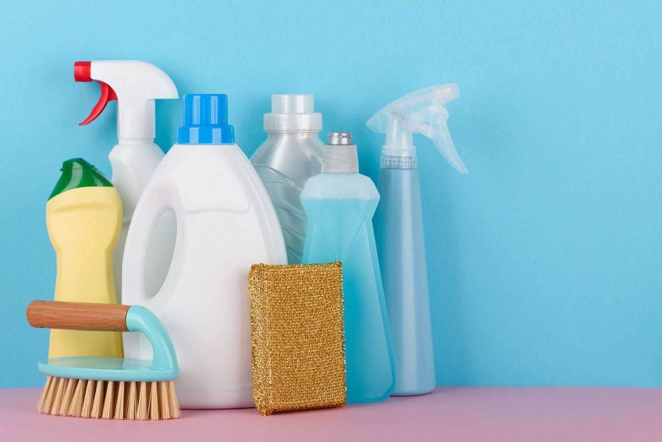 Cleaning products on pastel background