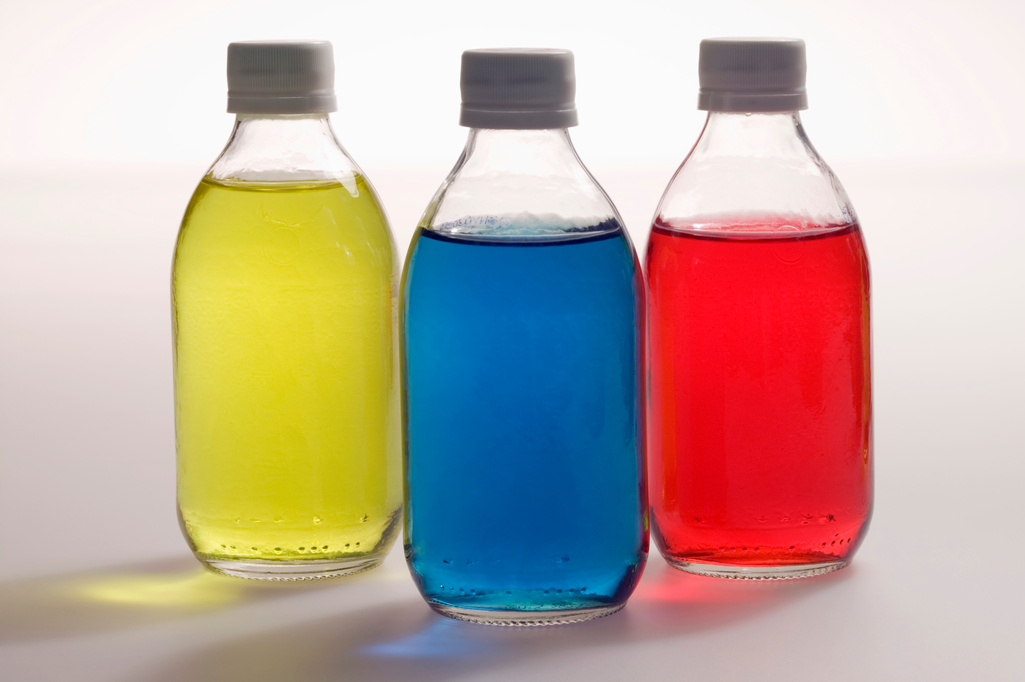 Bottles of colored liquid